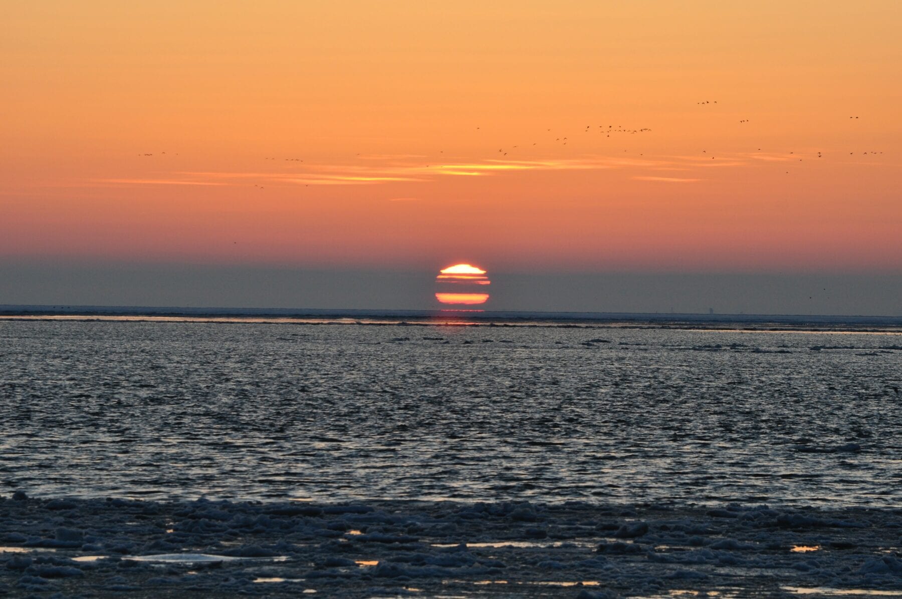 Het waddengebied zonsondergang